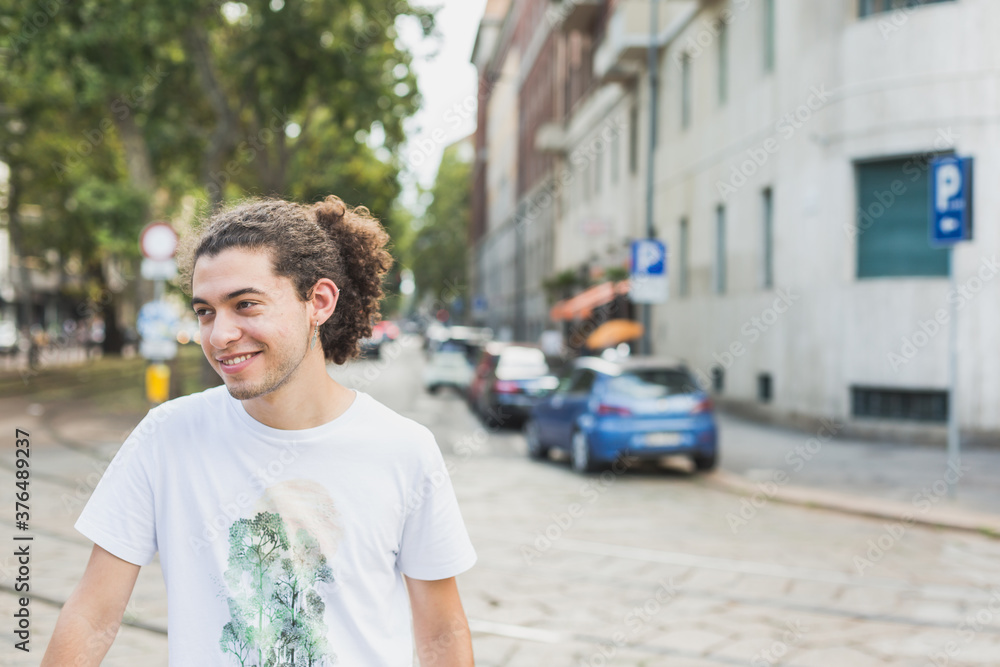 Young man posing in the city streets Young man posing in the city streets