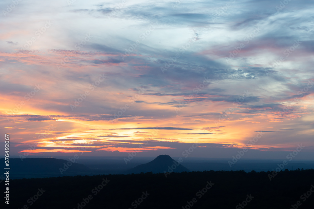 Fototapeta premium beautiful orange, pink and blue sky at the sunrise with moutain view. landscpae concept