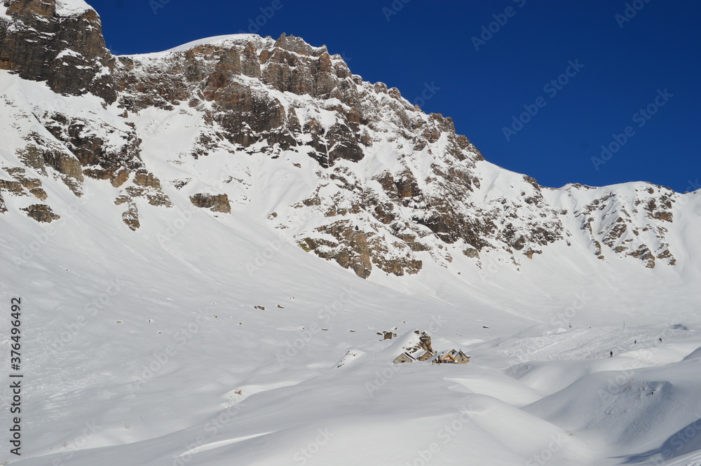 Skiing in the snow covered mountains of the San Domenico Ski Resort in Alps in Northern Italy Skiing in the snow covered mountains of the San Domenico Ski Resort in Alps in Northern Italy