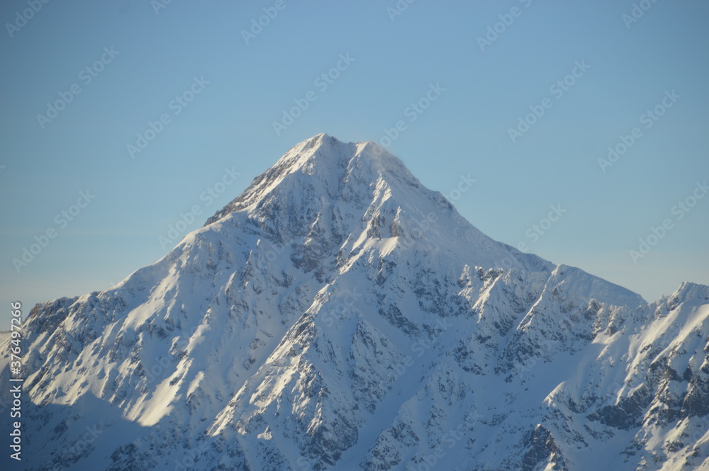 Skiing in the snow covered mountains of the San Domenico Ski Resort in Alps in Northern Italy