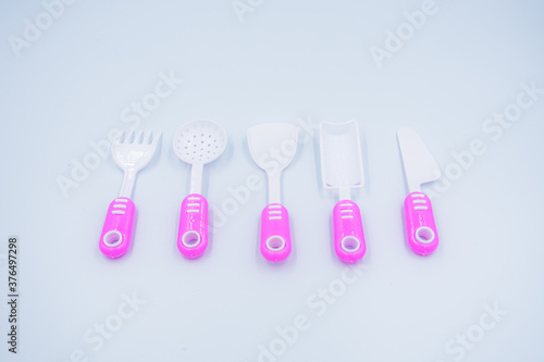 Children s pink plastic cooker for cooking on a white background