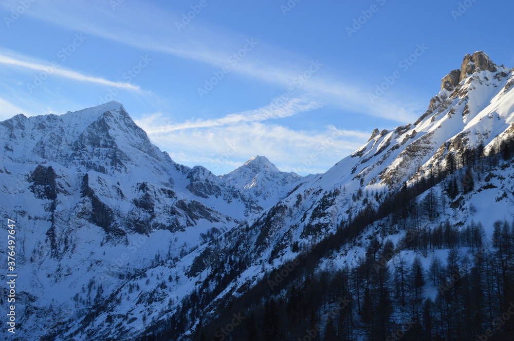Skiing in the snow covered mountains of the San Domenico Ski Resort in Alps in Northern Italy