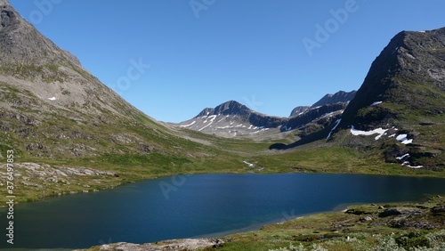 A beautiful lake surrounded by mountains in a mountain range of Norway.