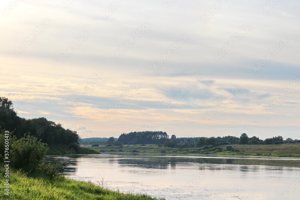 View of the river in the countryside at sunset