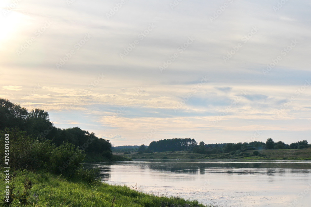 View of the river in the countryside at sunset