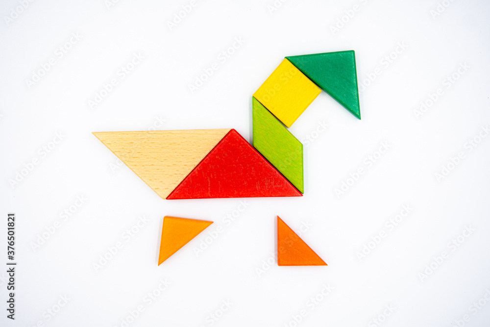 Color wood tangram puzzle in Duck shape on white background Color wood tangram puzzle in Duck shape on white background