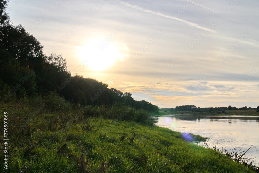 View of the river in the countryside at sunset View of the river in the countryside at sunset