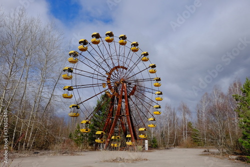 The famous Ferris wheel in an abandoned amusement park in Pripyat. Cloudy weather in the Chernobyl exclusion zone.