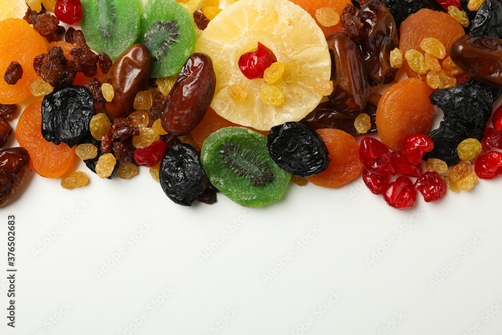 Dried fruits on white background, top view and space for text Dried fruits on white background, top view and space for text
