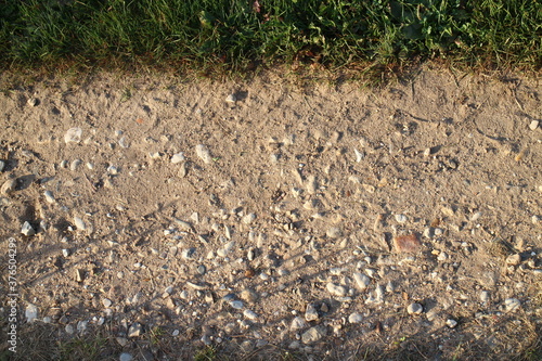 stones on the village road in summer in the village
