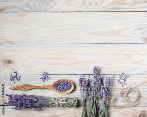 Bunch of dried lavender on wooden background. Top view, copyspace.