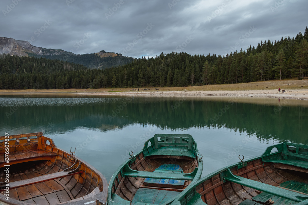 Close up of wooden boats on lake