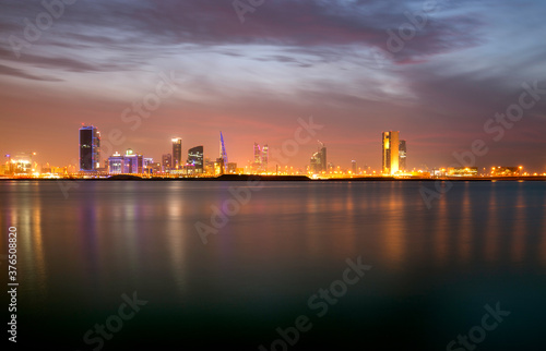 Dramatic hue in the sky amd Bahrain skyline at sunset