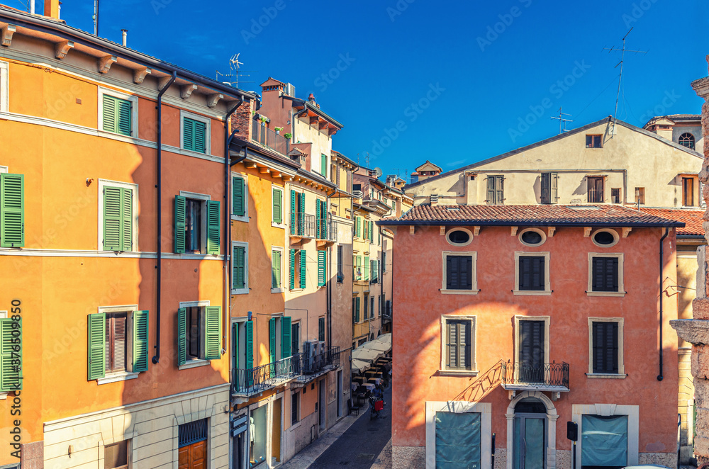 Typical italian street with traditional colorful buildings with shutter windows, aerial view