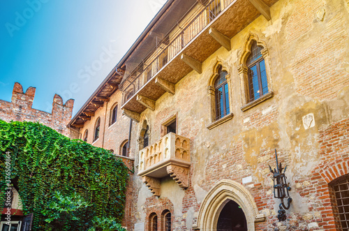 Casa di Giulietta with Juliet balcony, Juliet Capulet house courtyard and Teatro Nuovo theatre in Verona photo