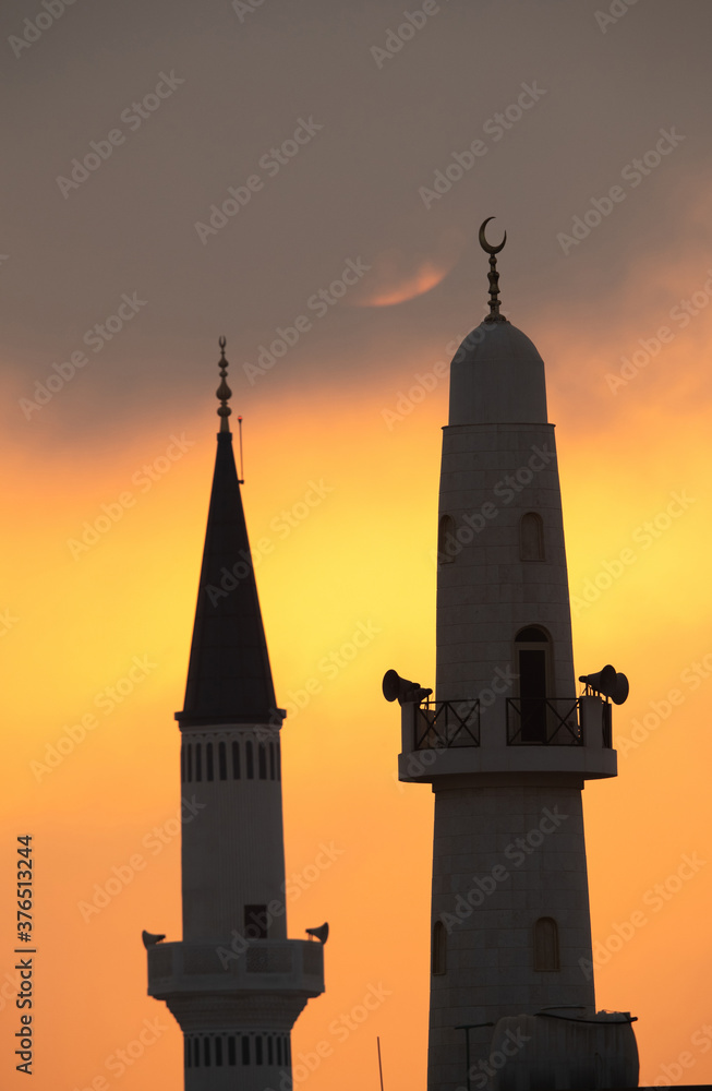 Minarets at sunrise a view from Busiateen coast, Bahrain