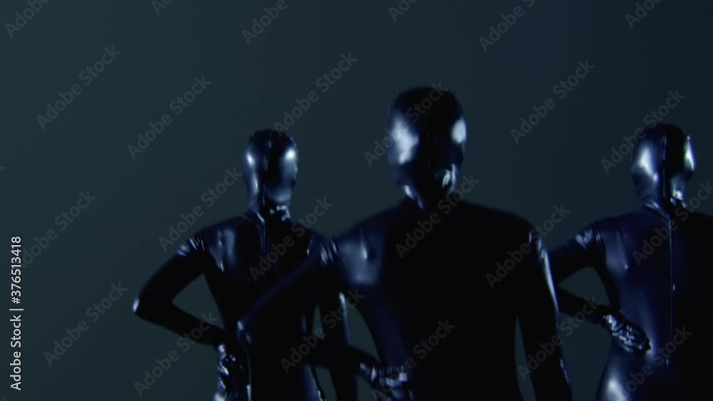Medium Shot of Three Performers Dancing Wearing Black Costume Medium Shot of Three Performers Dancing Wearing Black Costume