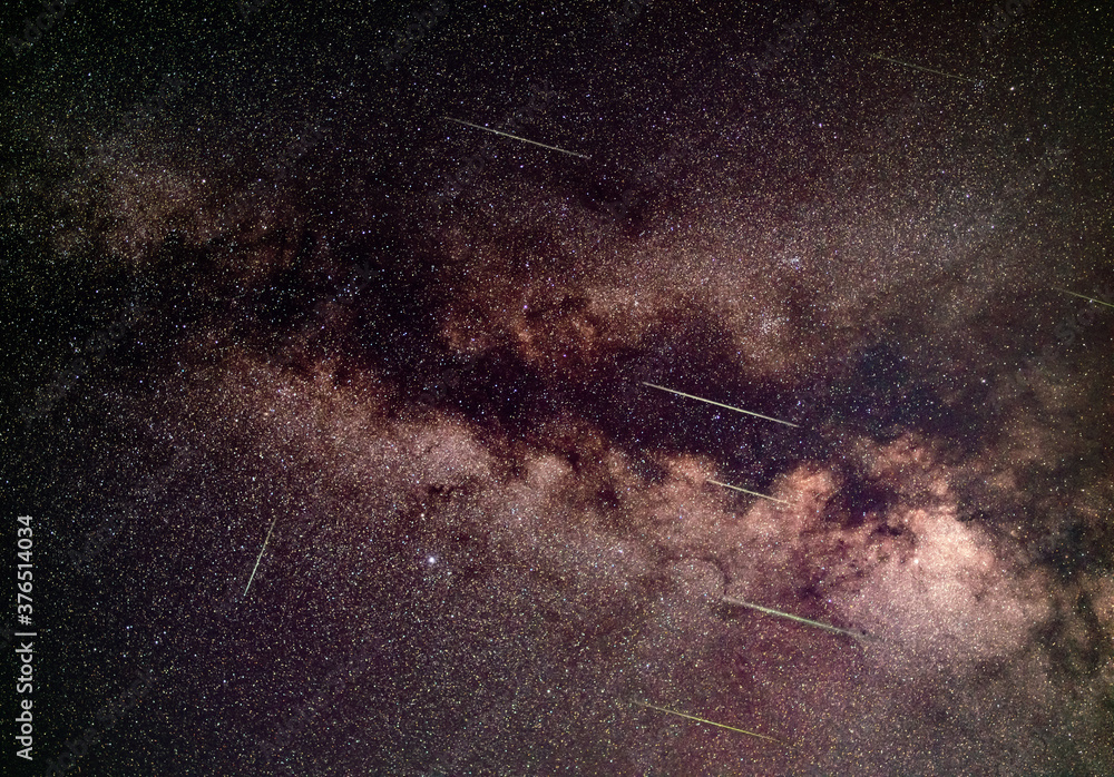 Meteor shower over Milky Way in region of Aquila constellation - long exposure photo