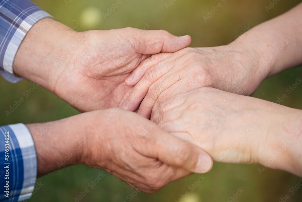 Closeup of senior couple holding hands Closeup of senior couple holding hands
