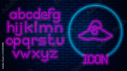 Glowing neon Elegant women hat icon isolated on brick wall background. Neon light alphabet. Vector.