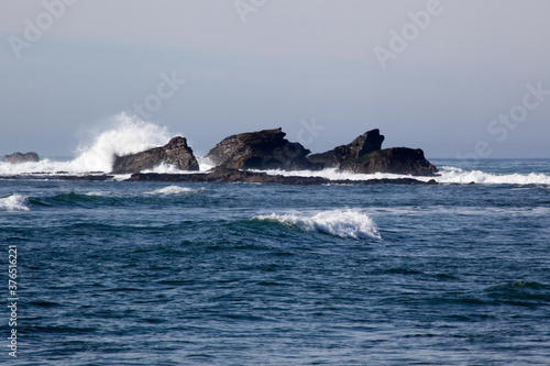 Ocean waves on a rocky shore © Allen Penton