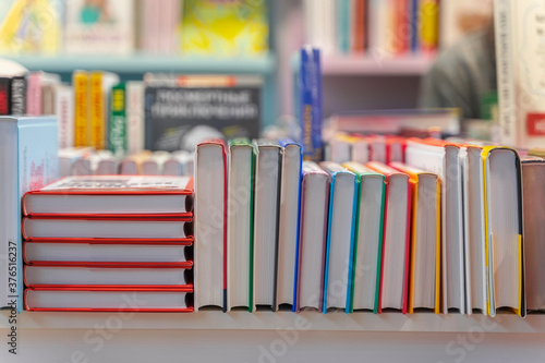 Fotografie Pile of books, abstract background in bookstore or in library