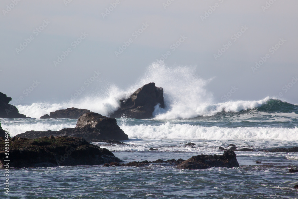 Rocks greeting the waves