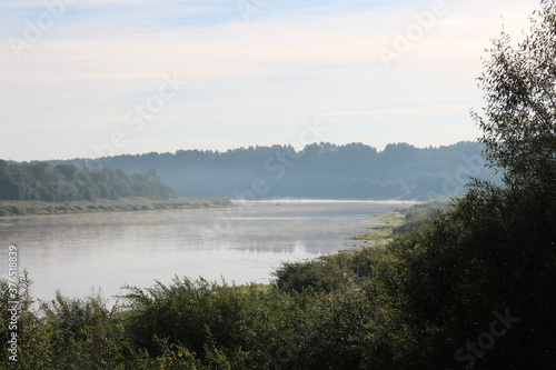 View of the misty river from the morning in summer © Andrey