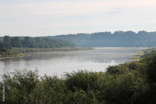 View of the misty river from the morning in summer © Andrey