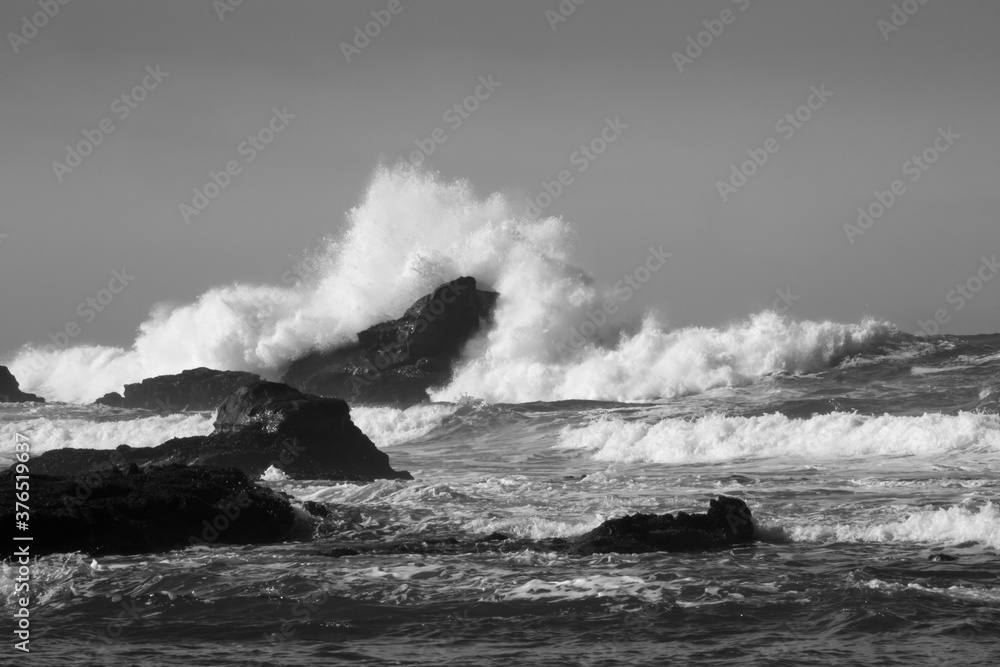 Surf breaking on a rocky shore