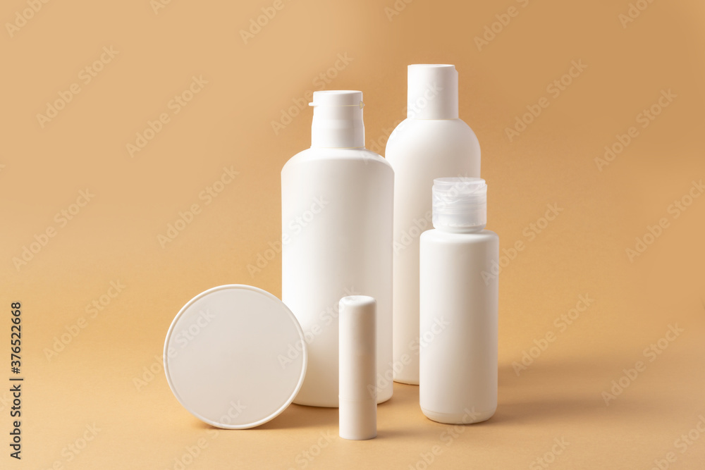 Set of white cosmetic bottles and jars with place to add text Set of white cosmetic bottles and jars with place to add text