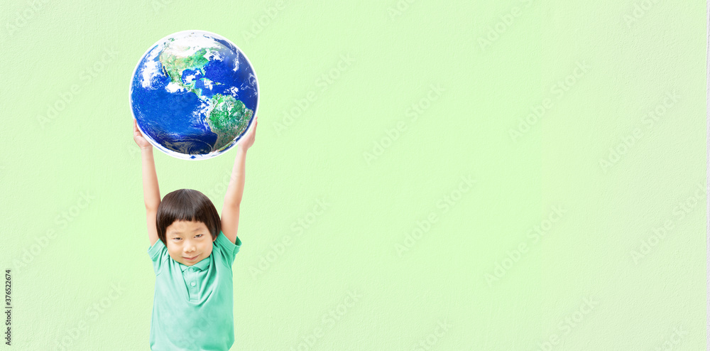 Kid raising world on green background, Ecological friendly and corporate social responsibility concept, Element of the image furnished by NASA Kid raising world on green background, Ecological friendly and corporate social responsibility concept, Element of the image furnished by NASA