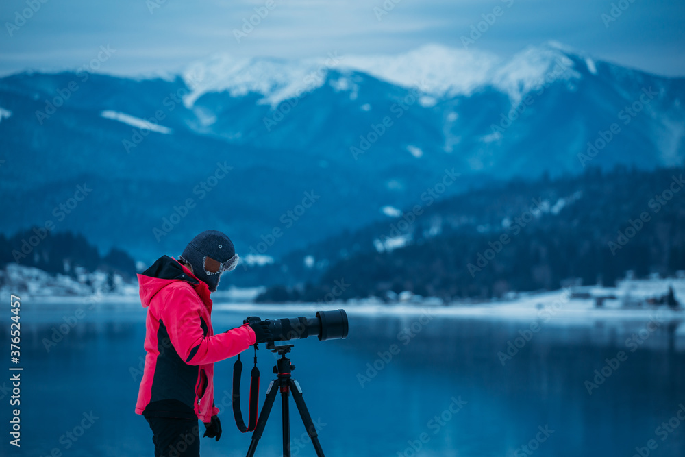 Landscape photographer taking images at a scenic mountain destination. 