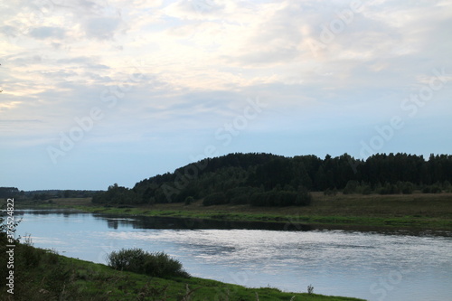 View of the river in the countryside at sunset © Andrey