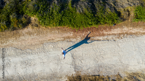 Aerial view of Katragaki beach road with man waiving, Tragaki, Zakynthos, Greece photo