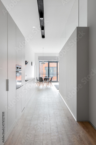 Long corridor in bright apartment