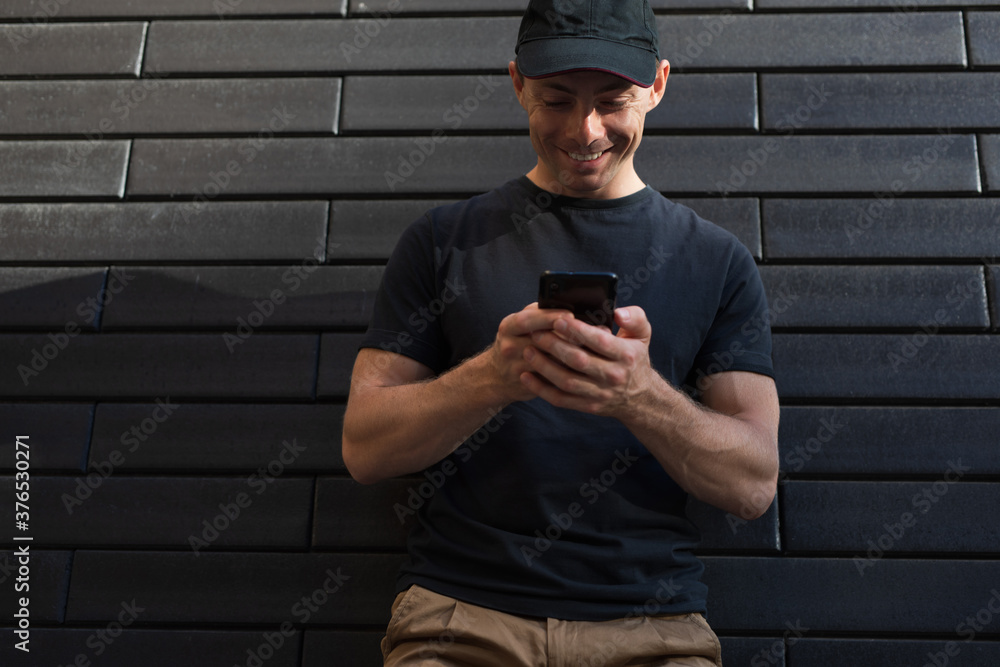 A man looks into a smartphone A man looks into a smartphone