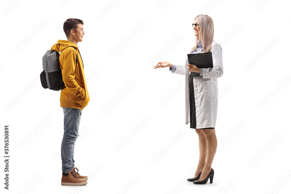 Full length profile shot of a female doctor talking to a male teenage student Full length profile shot of a female doctor talking to a male teenage student