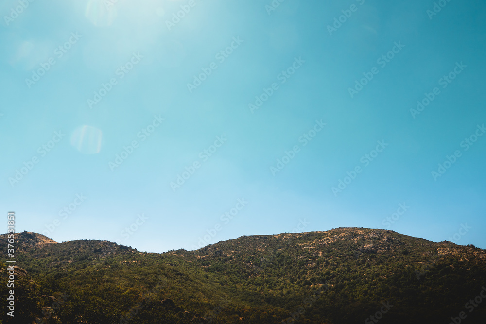 Cloudless blue sky over the mountains on a sunny summer day. 
