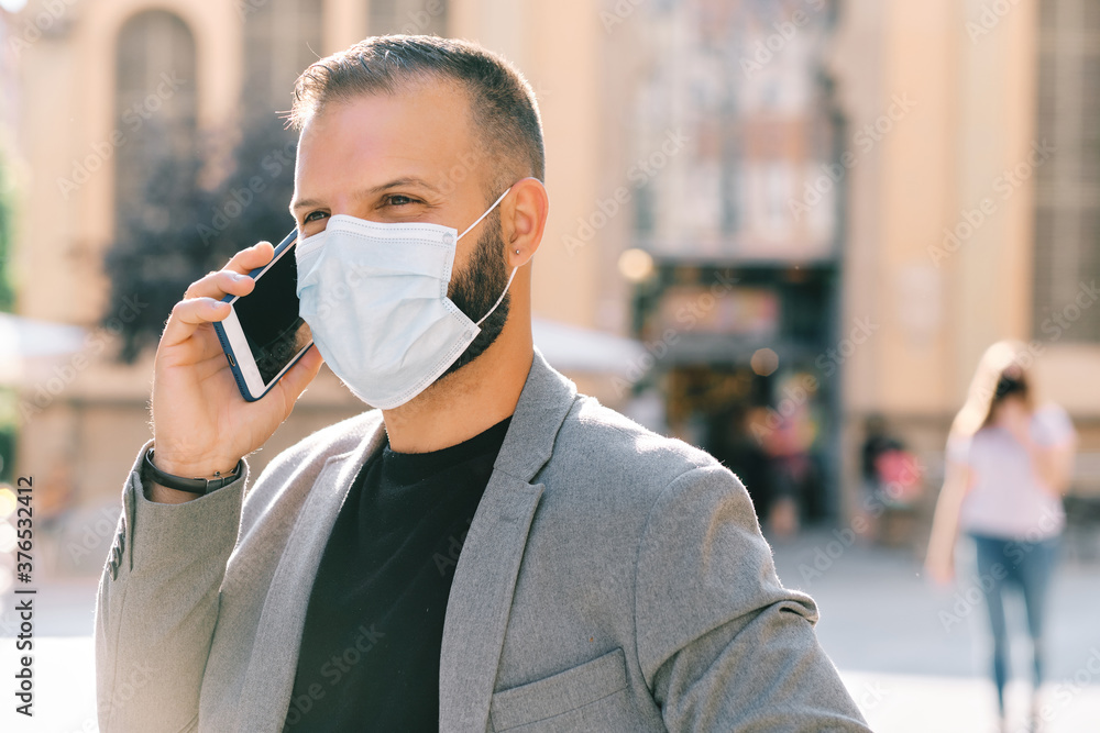 adult man in grey casual suit with mask and social distance - coronavirus concept adult man in grey casual suit with mask and social distance - coronavirus concept