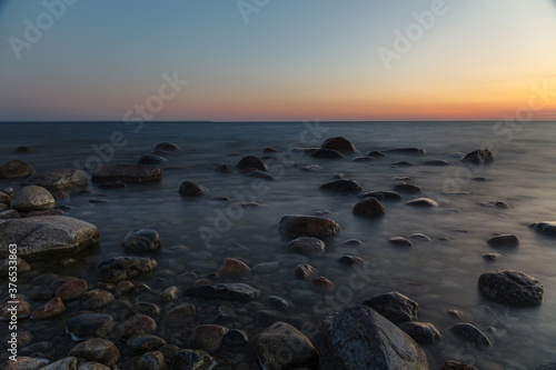 Rocky shore and peninsula of Baltic sea at sunset. Nordic minimalistic wilderness. © yegorov_nick