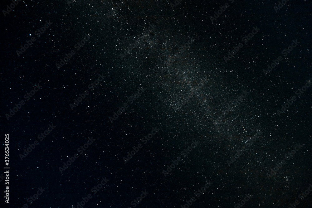 Starry sky and Summer meadow with trees. Summer night. The milky way over the field. Starry sky and Summer meadow with trees. Summer night. The milky way over the field.