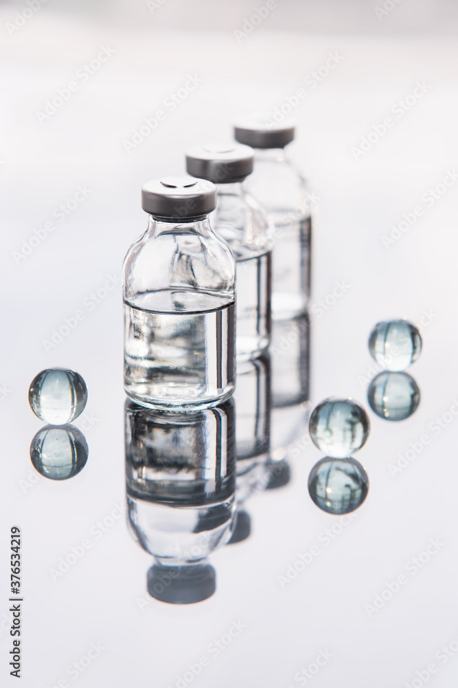 Set of transparent medical bottles and bottles with liquid with different transparent balls. Set of transparent medical bottles and bottles with liquid with different transparent balls.
