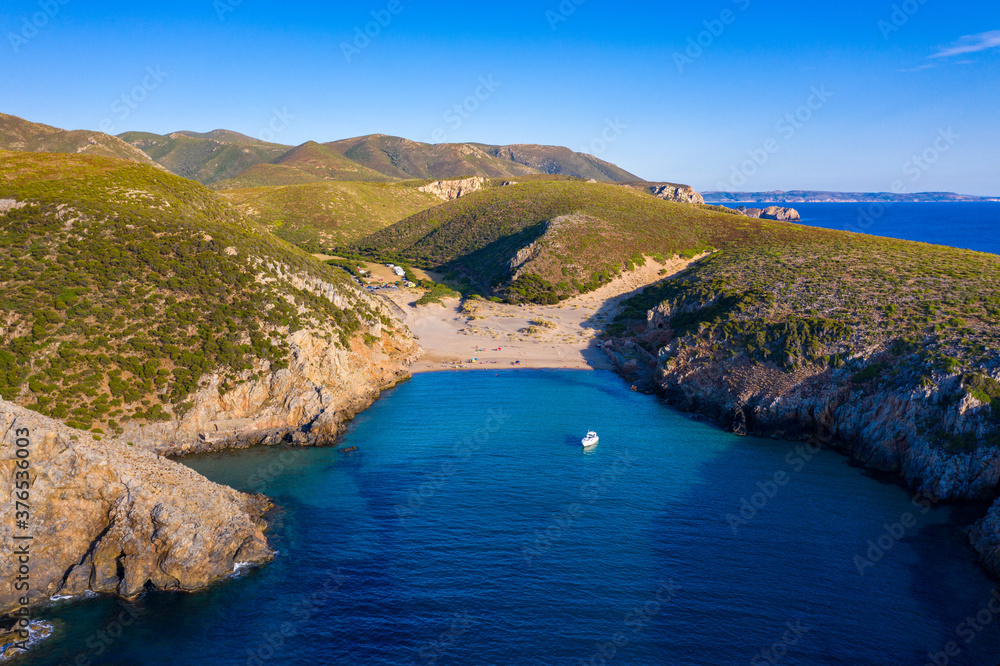 Fototapeta premium Cala Domestica beach, Sardinia, Italy. Sardinia is the second largest island in mediterranean sea. Sardinia, Cala Domestica beach, Italy. Beach Cala Domestica, Sardegna, Italy.