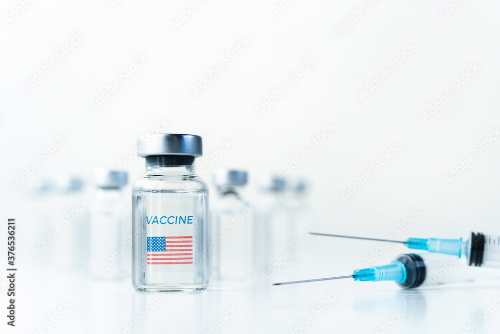 Transparent vials with USA, american flag. Vaccine, syringes for covid-19 coronavirus, flu, infectious diseases.Injection after clinical trials for vaccination of human, people.Medicine, drug concept Transparent vials with USA, american flag. Vaccine, syringes for covid-19 coronavirus, flu, infectious diseases.Injection after clinical trials for vaccination of human, people.Medicine, drug concept