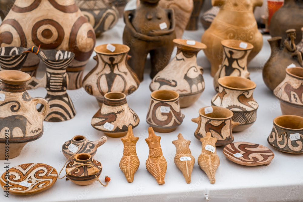 Fototapeta premium Happy colorful ceramics. Traditional Romanian handmade ceramics market at the potters fair from Sibiu, Romania
