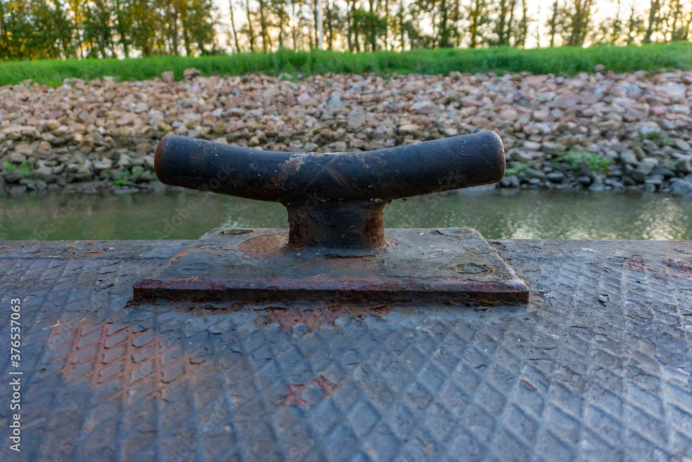 Black Mooring duck. Mooring bollard on floating jetty. Black Mooring duck. Mooring bollard on floating jetty.
