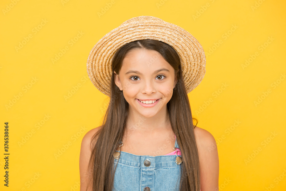 Summer holidays. Fashionably dressed girl. Enjoying vacation. Fancy outfit. Summer fashion. Good vibes. Beach style. Beauty in hat. Portrait of happy cheerful girl in summer hat yellow background Summer holidays. Fashionably dressed girl. Enjoying vacation. Fancy outfit. Summer fashion. Good vibes. Beach style. Beauty in hat. Portrait of happy cheerful girl in summer hat yellow background