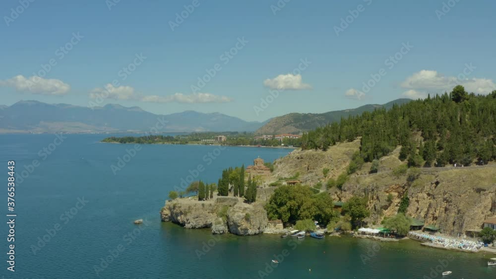 Aerial view Ohrid Macedonia. Drone flight over the historic church standing under a mountain on the shores of Lake Ohrid with a beautiful landscape. Aerial view Ohrid Macedonia. Drone flight over the historic church standing under a mountain on the shores of Lake Ohrid with a beautiful landscape.