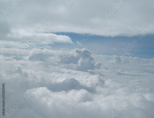 fluffy white clouds against a blue sky